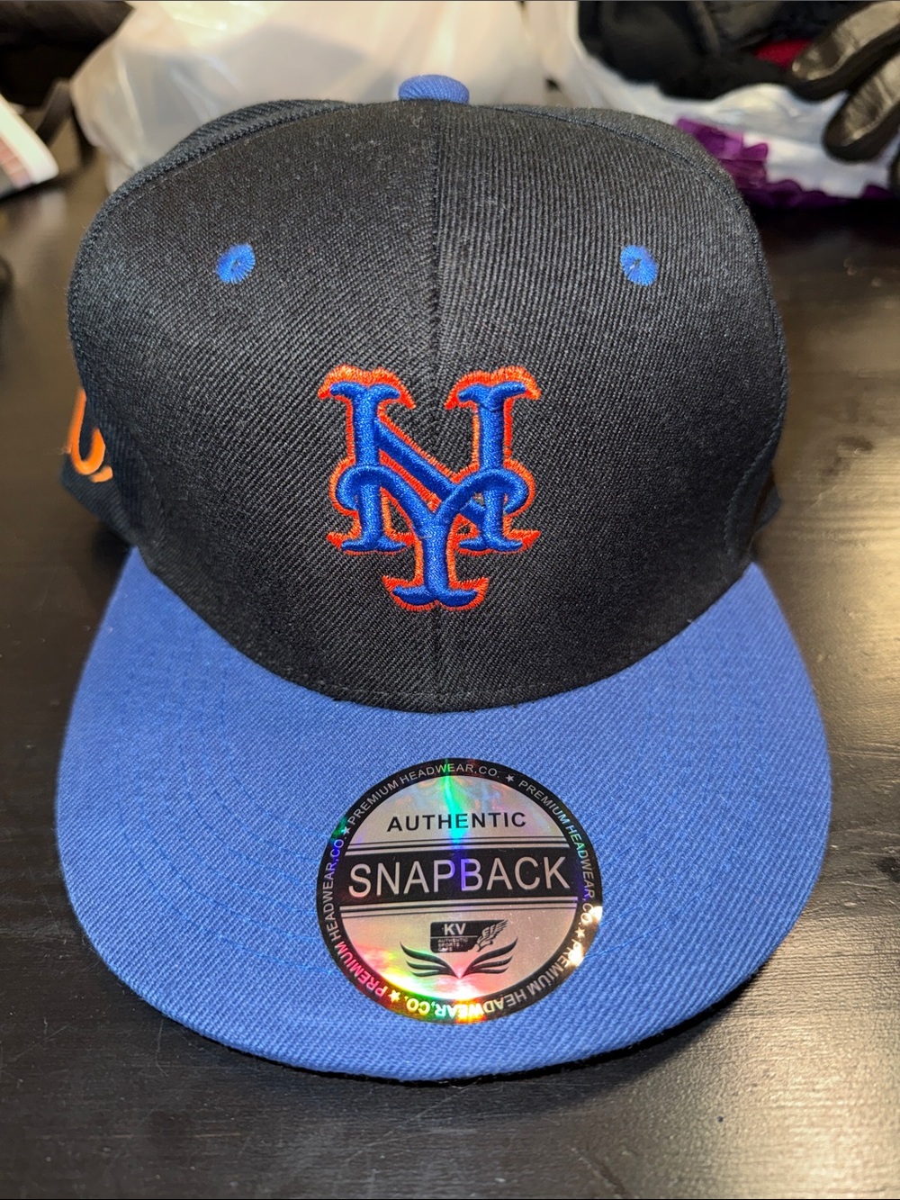 Snapback Hat with Blue Visor and Black Crown - Team Logo Accent